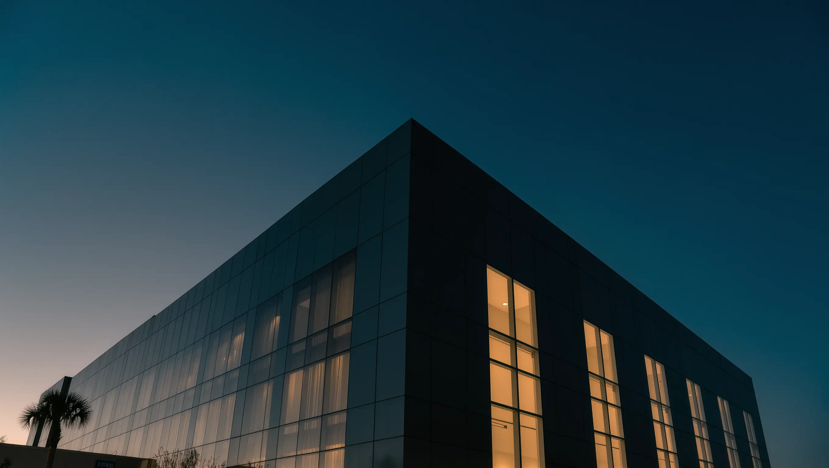Hospital exterior at blue hour — TWIY Health Southeast operations